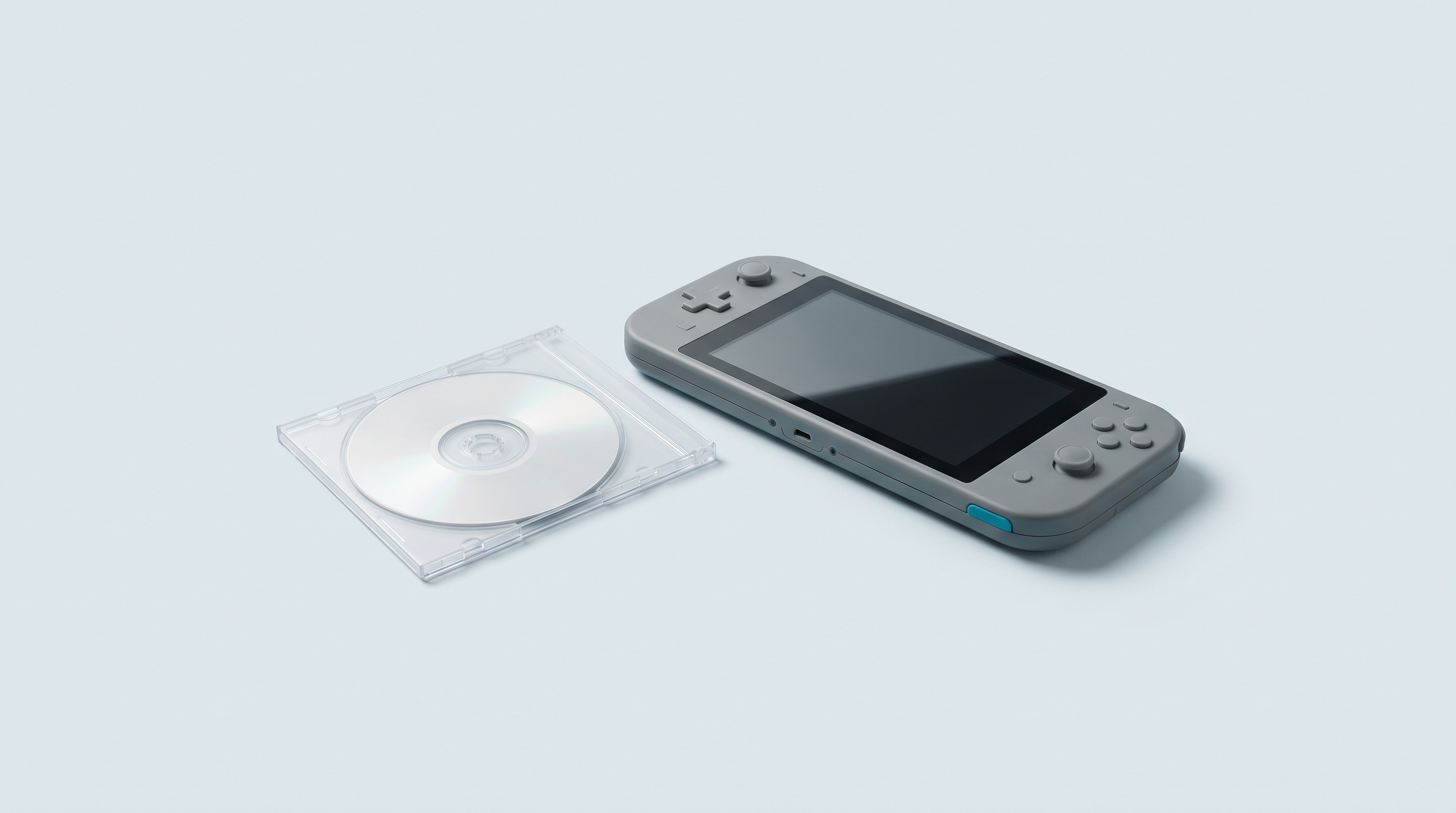 Petit disque optique dans son boîtier plastique, près d'une console portable rétro à grand écran