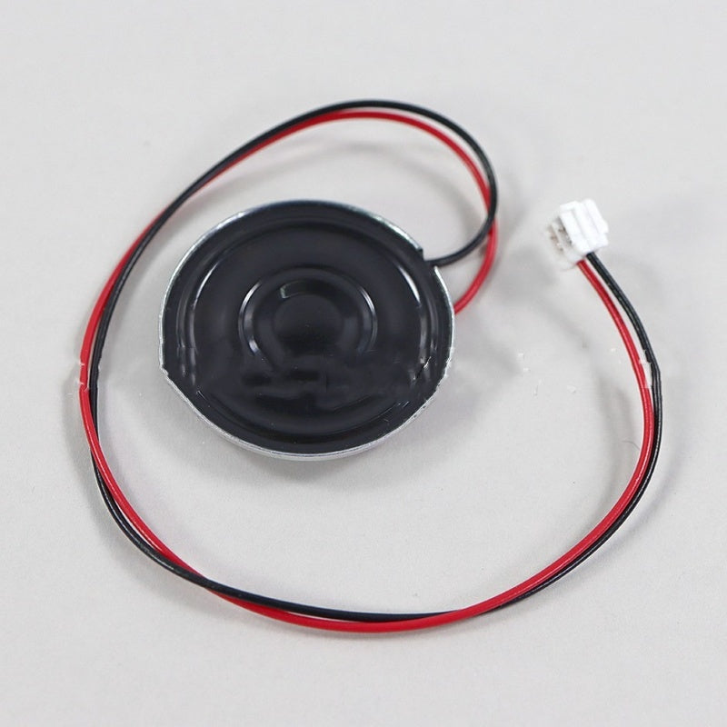 Front of the Game Gear speaker, black cone