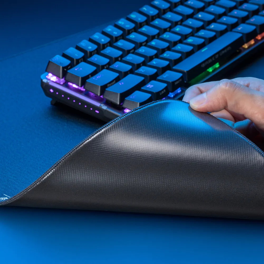 Main features of ROG Hone Ace XXL gaming mouse pad with a mechanical keyboard, showcasing its durable surface.