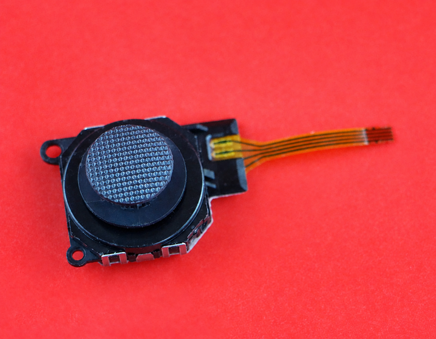 PSP 3000 analog stick, textured cap and orange ribbon cable