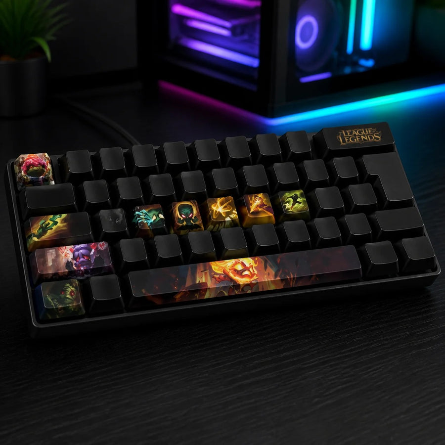 Amumu keycaps fitted on a black mechanical keyboard in front of a gaming PC