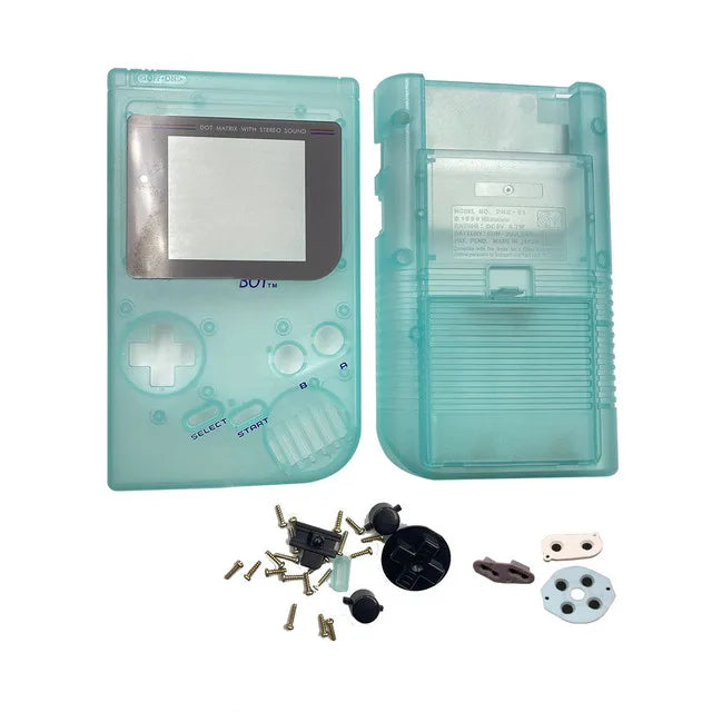 Coque complète Game Boy DMG vert luminescent, façade, dos et accessoires présentés à plat