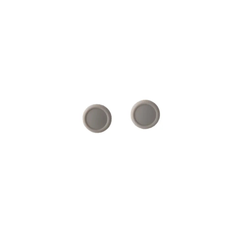 2 light grey joystick caps