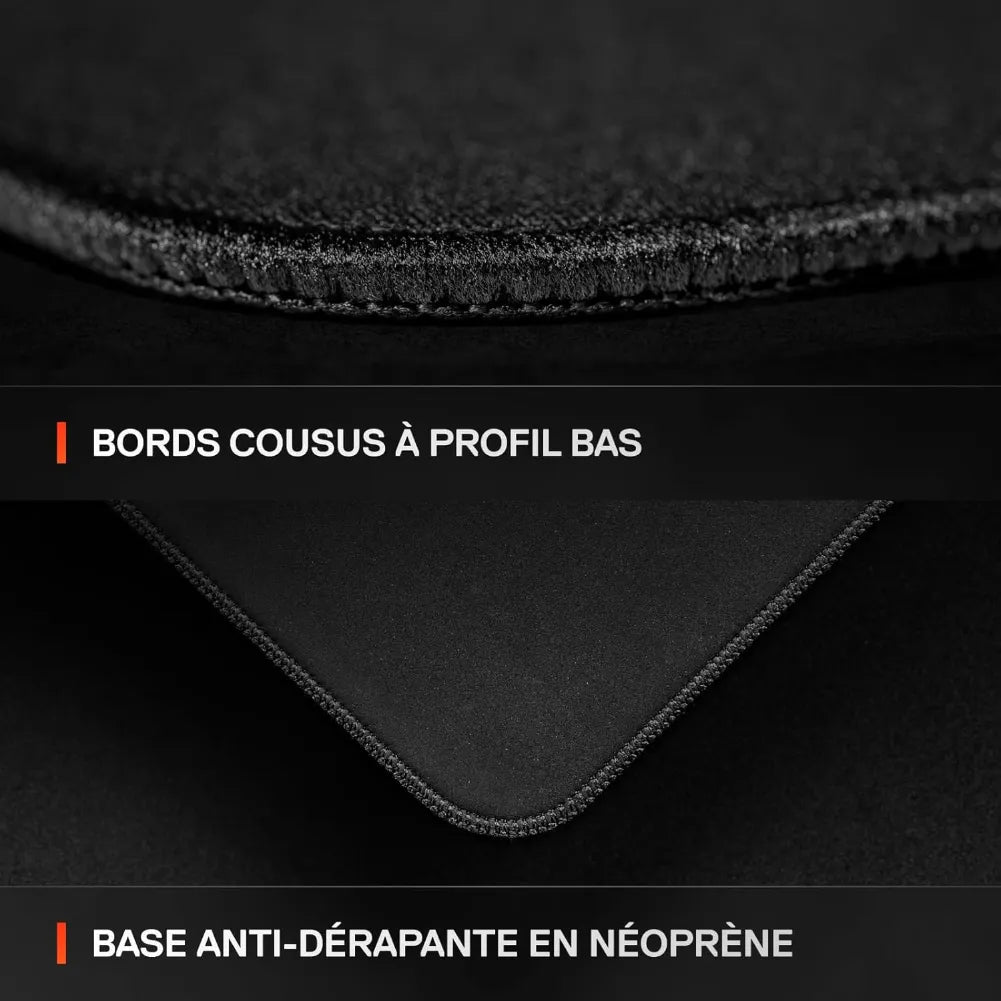 Close-up of SteelSeries QcK Performance Speed L mousepad showing low-profile stitched edges and non-slip neoprene base.