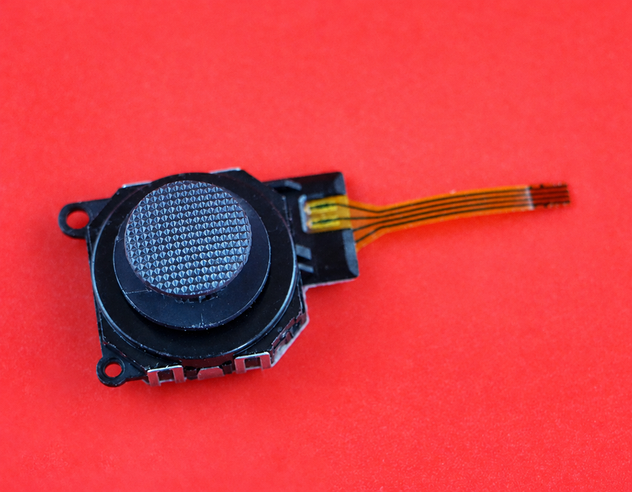 PSP 3000 replacement analog stick with its ribbon cable