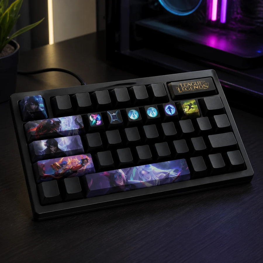 Aphelios keycaps fitted on a black mechanical keyboard in front of a gaming PC