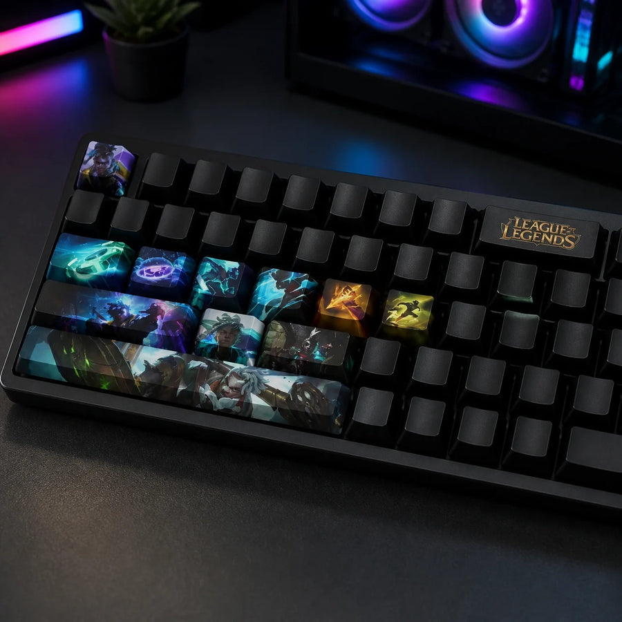 Ekko keycaps fitted on a black mechanical keyboard in front of a gaming PC