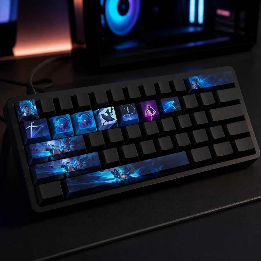 Gwen keycaps fitted on a black mechanical keyboard in front of a gaming PC